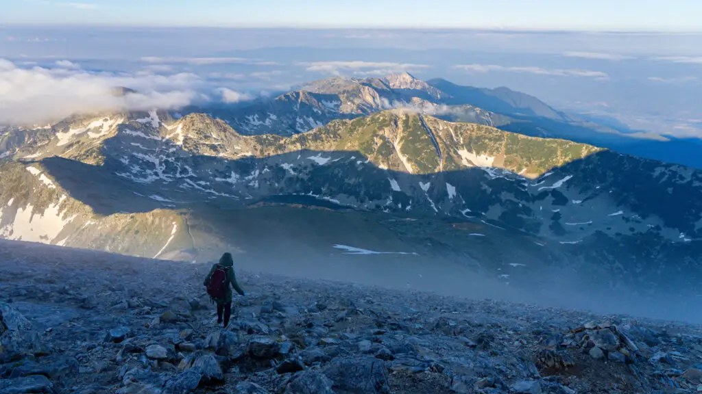 Person walking down from Vihren Peak in Pirin NP