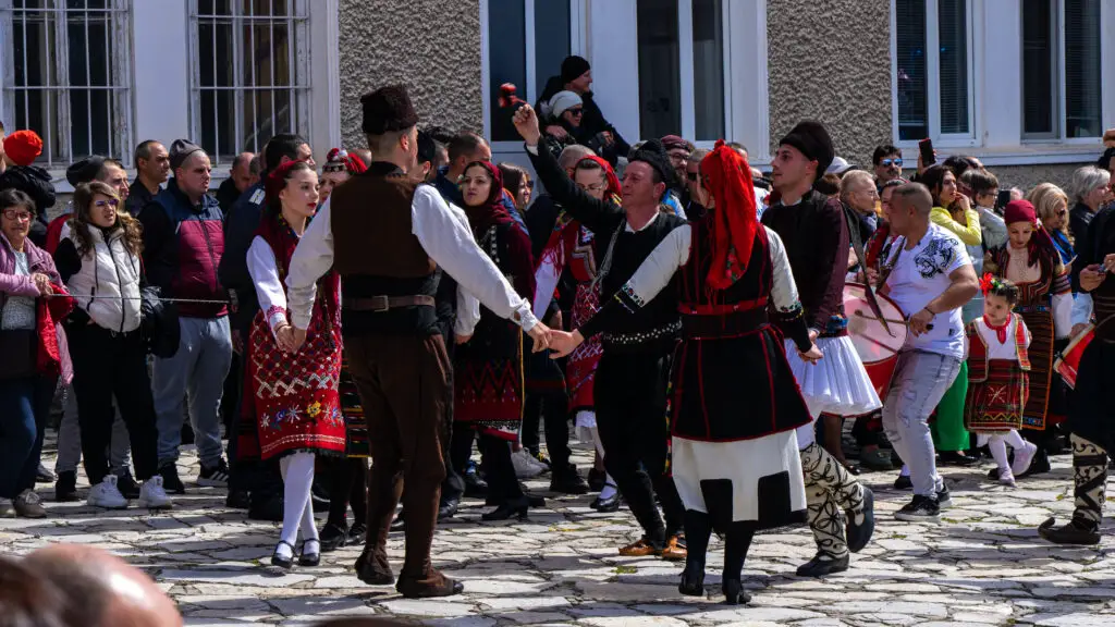 People dancing the horo during the Kukeri ritual in Eleshnitsa