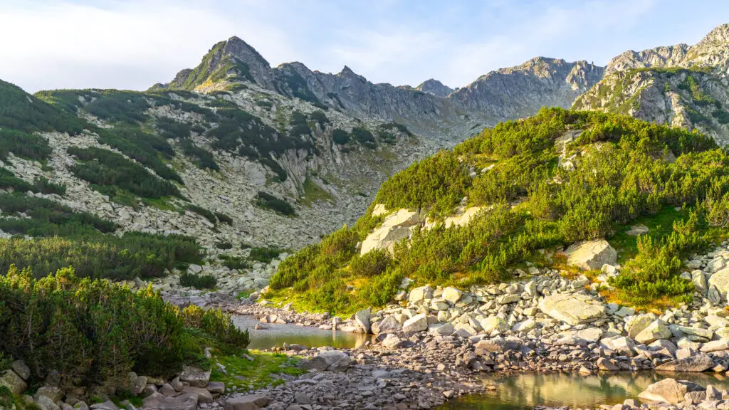 Morning sunshine on mountains in Pirin