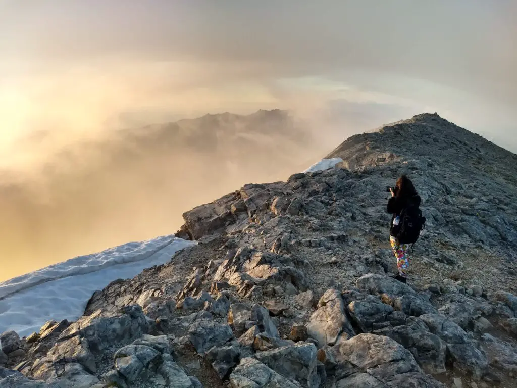 Jessica taking photos on the Vihren Peak during sunrise