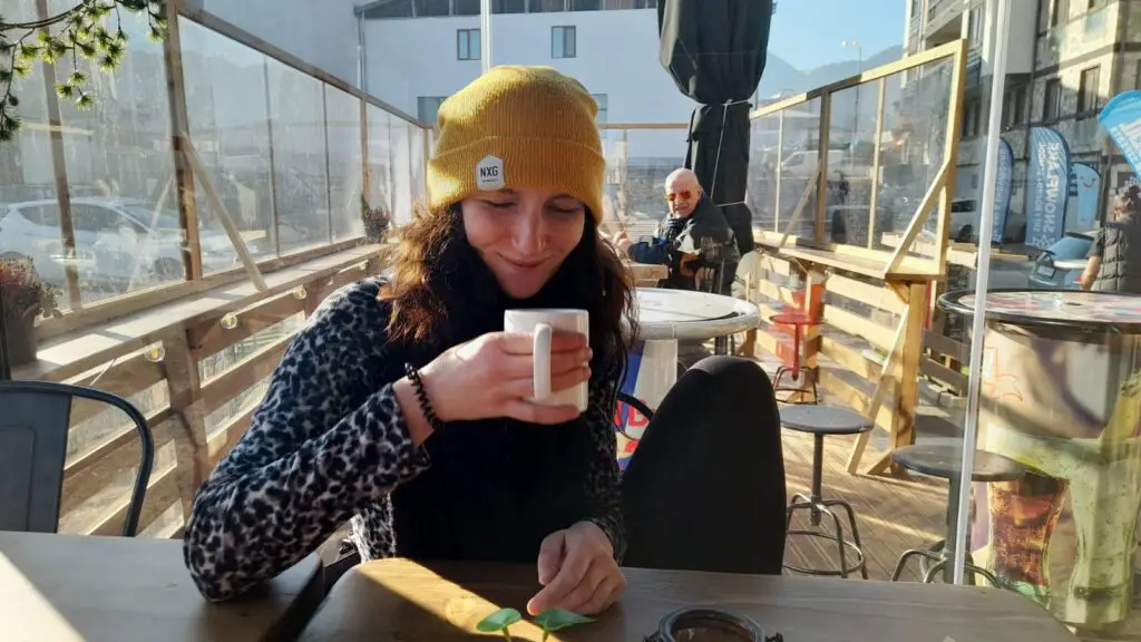 Jessica with cup of coffee in Bansko